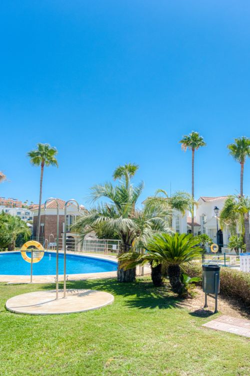 Stylish south east facing, three-bedroom semi detached townhouse located in Riviera del Sol