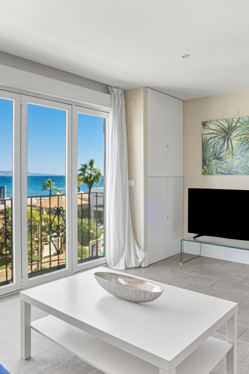 Two-bedroom, beachfront apartment with sea and mountain views, located in the heart of Puerto Banús.