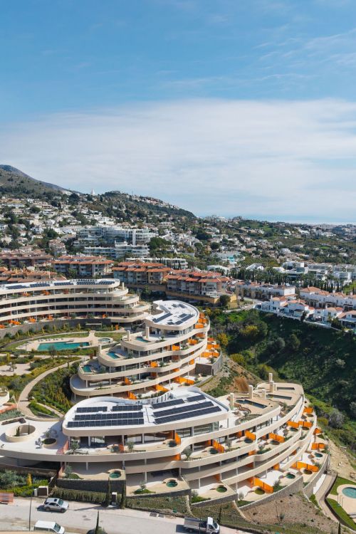 Experience refined coastal living in this brand-new luxury apartment set within the prestigious Higuerón Resort.