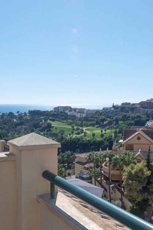 A furnished southwest-facing duplex penthouse in Torrequebrada with panoramic sea and golf views, expansive terraces and two garage parking spaces.